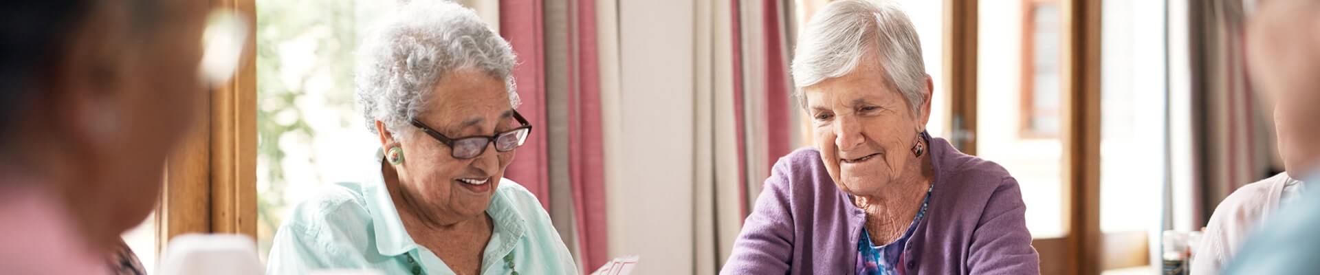 care home residents playing cards